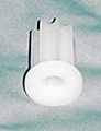 A white plastic socket designed to fit round or square tubing for a grip ring stem.